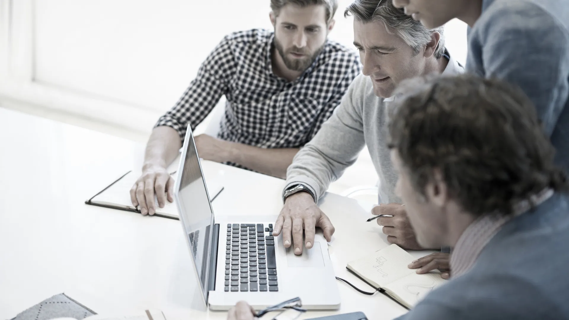 Global compliance team reviewing an audit report